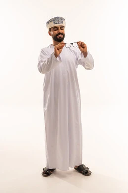 Omani Man in Traditional Dress Holding Eyeglasses