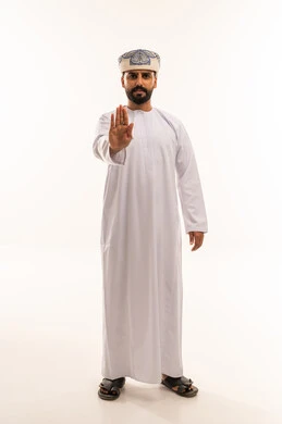 Omani Man Making Stop Gesture in Traditional Clothing