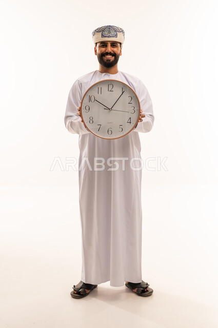 Omani Man Holding Wall Clock on White Background