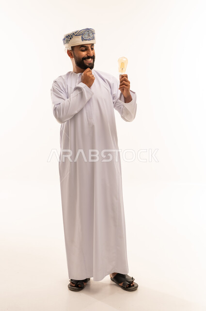 Omani Man Holding Lightbulb Concept Idea