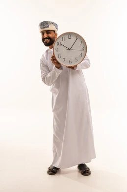 Omani Man Holding Wall Clock on White Background