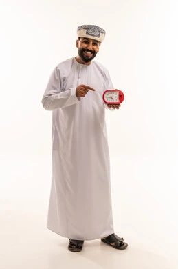 Omani Man with Alarm Clock on White Background