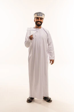 Omani Man in Traditional Dress with Paper Airplane