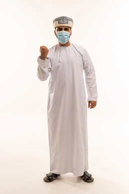 Omani Man in Traditional Dishdasha and Medical Mask