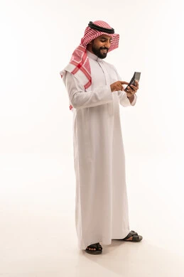 Saudi Man in Traditional Thobe Using Calculator