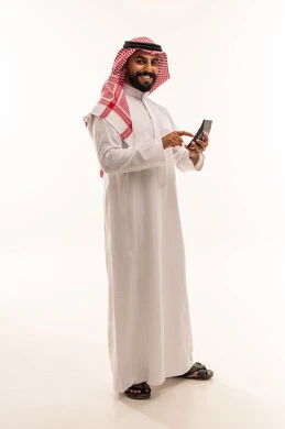 Saudi Man in Traditional Thobe Using Calculator