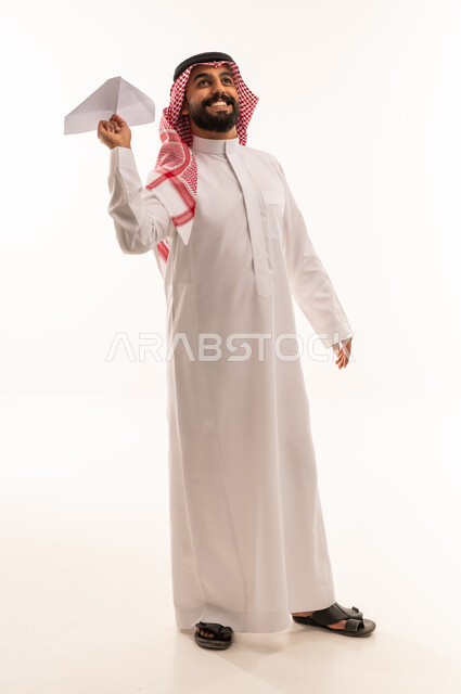 Saudi Man in Thobe Holding Paper Plane White Background