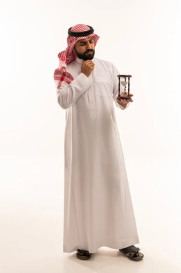 Saudi Man Holding Hourglass on White Background