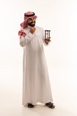 Saudi Man in Traditional Thobe Holding Hourglass