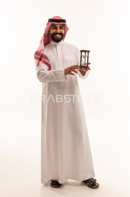 Saudi Man Holding Hourglass on White Background