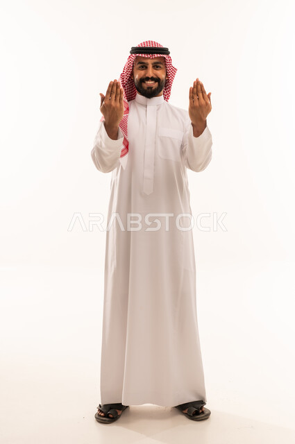 Saudi Man in Traditional Thobe Praying on White Background