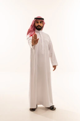 Saudi Man in Traditional Thobe Making Stop Gesture