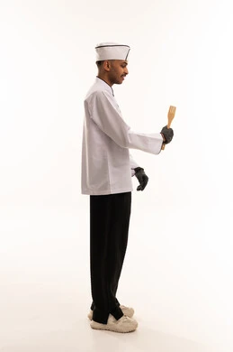 Saudi Male Chef in White Uniform Holding Spatula