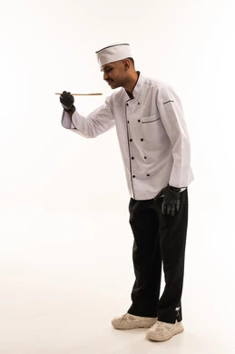Professional Arab Chef Tasting Food on White Background