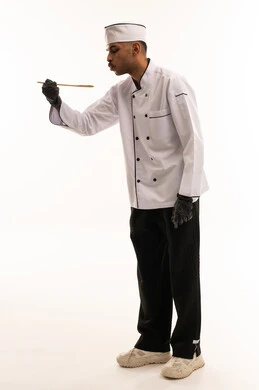Saudi Male Chef in White Uniform with Wooden Spoon