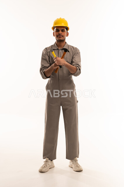 Saudi Construction Worker with Hammer on White Background
