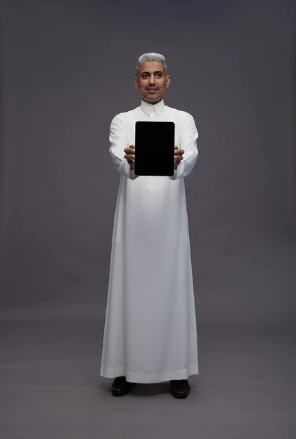 Saudi Man Holding Digital Tablet with Blank Screen