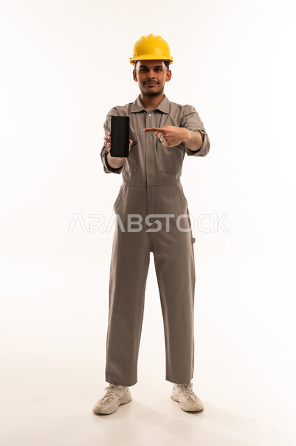 Saudi Engineer Holding Smartphone on White Background