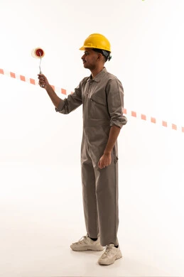 Saudi Painter in Safety Gear with Paint Roller