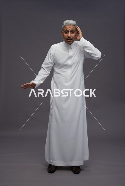 Saudi Man in White Thobe with Expressive Hand Gesture