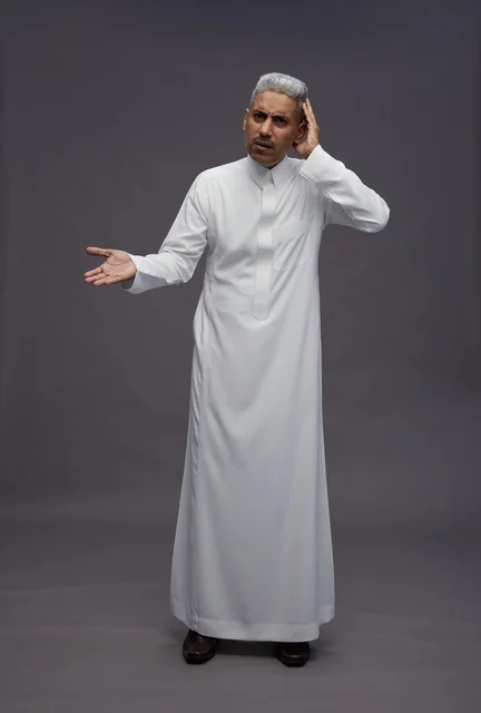 Saudi Man in White Thobe with a Confused Expression