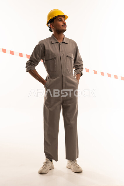 Saudi Male Engineer in Grey Jumpsuit and Safety Helmet