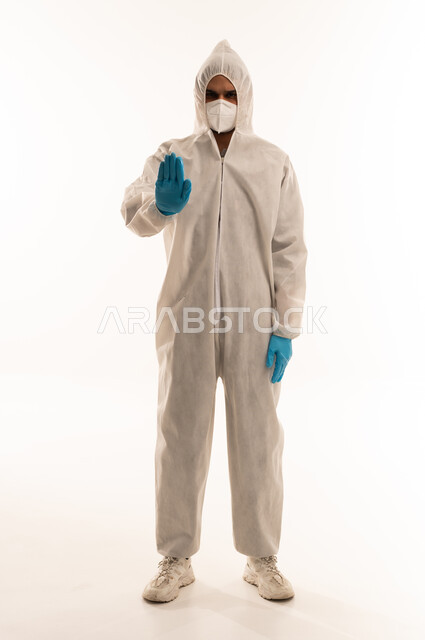 Arab Man in Hazmat Suit Making Stop Gesture