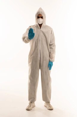 Arab Man in Hazmat Suit Making Stop Gesture