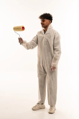 Saudi Painter in White Protective Coverall with Roller