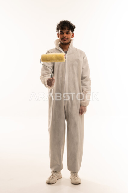 Arab Painter Holding Paint Roller in White Coveralls