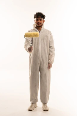 Arab Painter Holding Paint Roller in White Coveralls