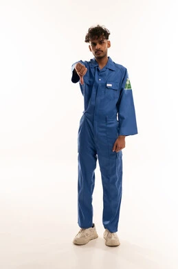 Saudi Worker in Blue Jumpsuit Giving Thumbs Down
