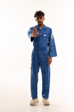 Saudi Worker in Blue Uniform Making Stop Gesture