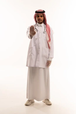 Saudi Male Doctor Making Stop Gesture in Studio