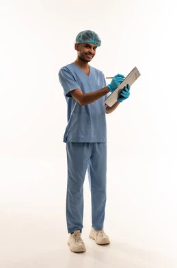 Middle Eastern Male Nurse in Blue Scrubs with Clipboard