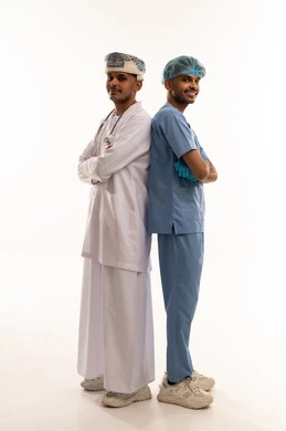 Omani Doctors in Traditional Attire and Medical Scrubs