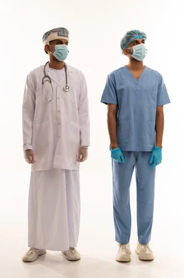 Omani Medical Professionals in Scrubs and White Coat