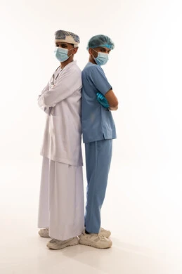 Omani Medical Professionals in Scrubs and Lab Coat
