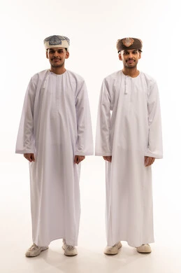 Omani Men in Traditional White Dishdasha and Kumma