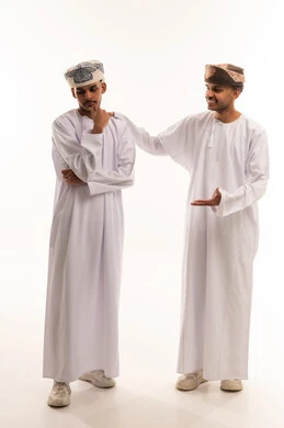 Two Omani Men in Traditional Dishdasha on White Background
