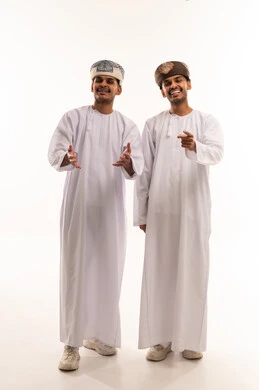 Two Omani Men in Traditional Dishdasha and Kumma