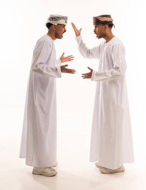 Omani Men in Traditional Dress Arguing on White Background