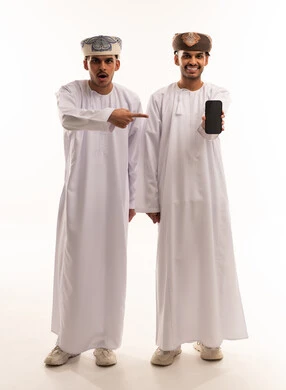 Omani Men in Traditional Dress Holding Smartphone