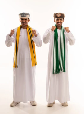 Omani Men in Traditional Dress Celebrating Victory