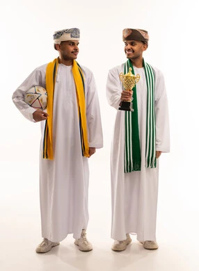 Omani Men Celebrating Sports Victory with Trophy