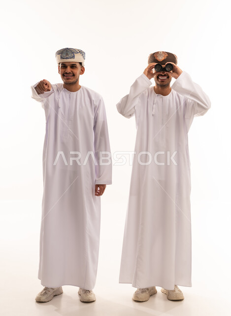 Omani Men in Traditional Dress with Binoculars