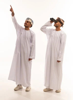 Omani Men in Traditional Dress Looking Up