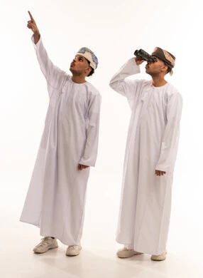 Omani Men in Traditional Dress with Binoculars