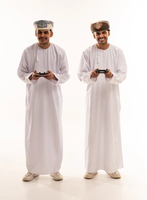 Omani Men with Video Game Controllers on White Background
