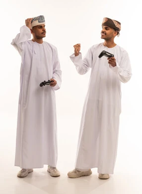 Omani Men Playing Video Games on White Background